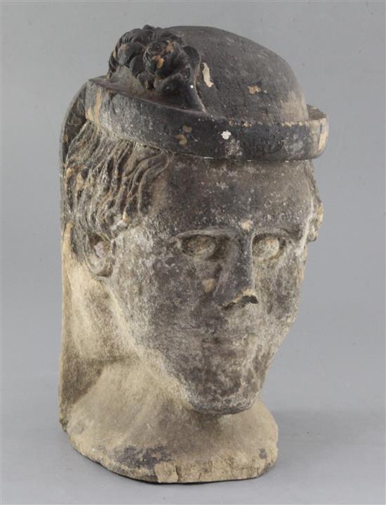A medieval or later limestone head, height 14in.